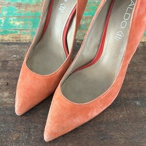 Orange suede pumps